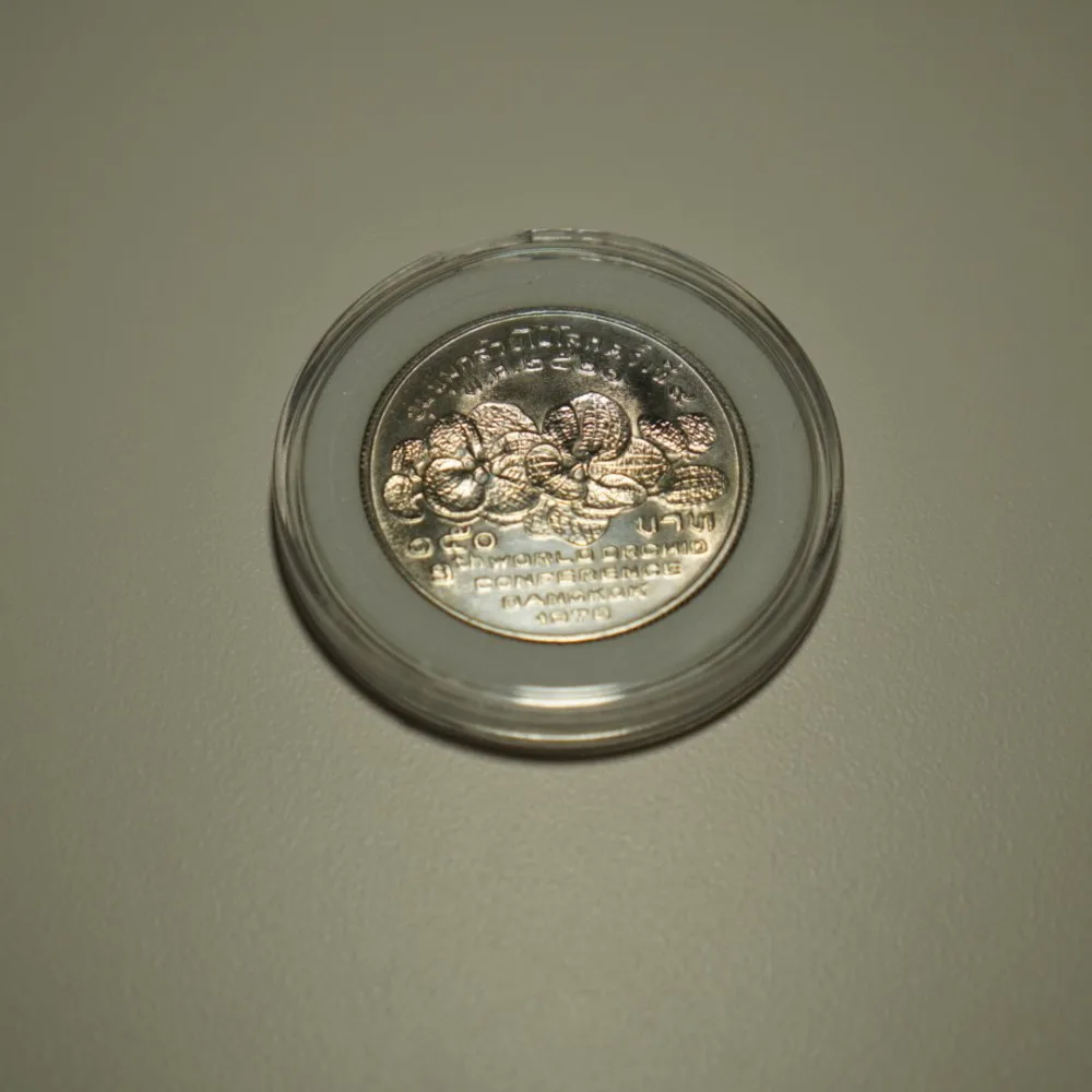 เหรียญ 150 บาท เหรียญกษาปณ์ที่ระลึกรัชกาลที่ 9 งานชุมนุมกล้วยไม้โลกครั้งที่ 9 — รูปที่ 2